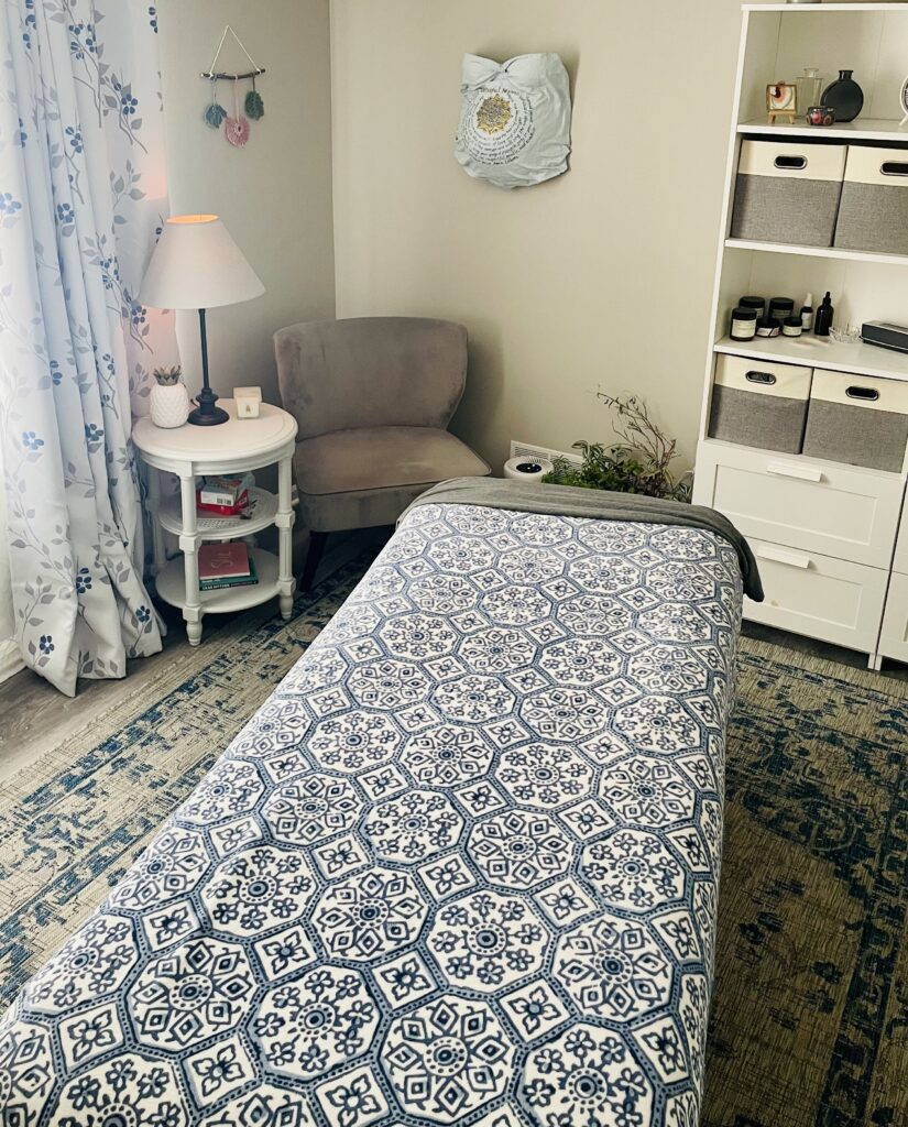 Cozy room with patterned massage table.