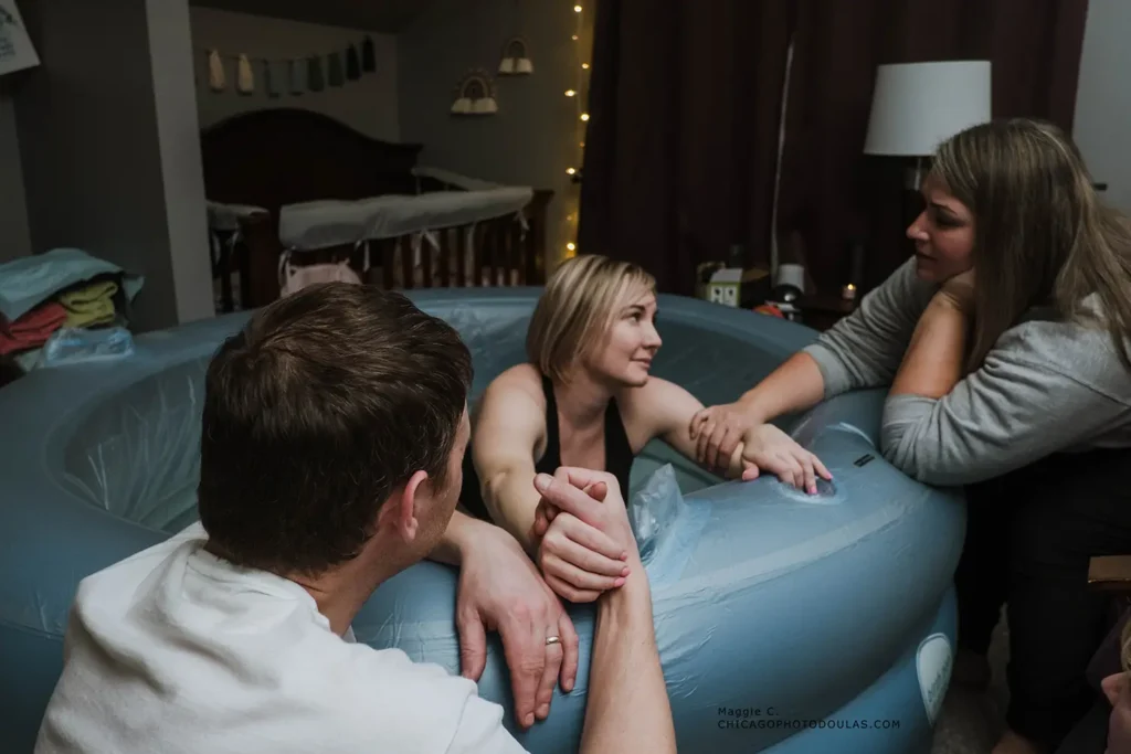 Three friends enjoying a relaxed conversation on a couch in a cozy room.