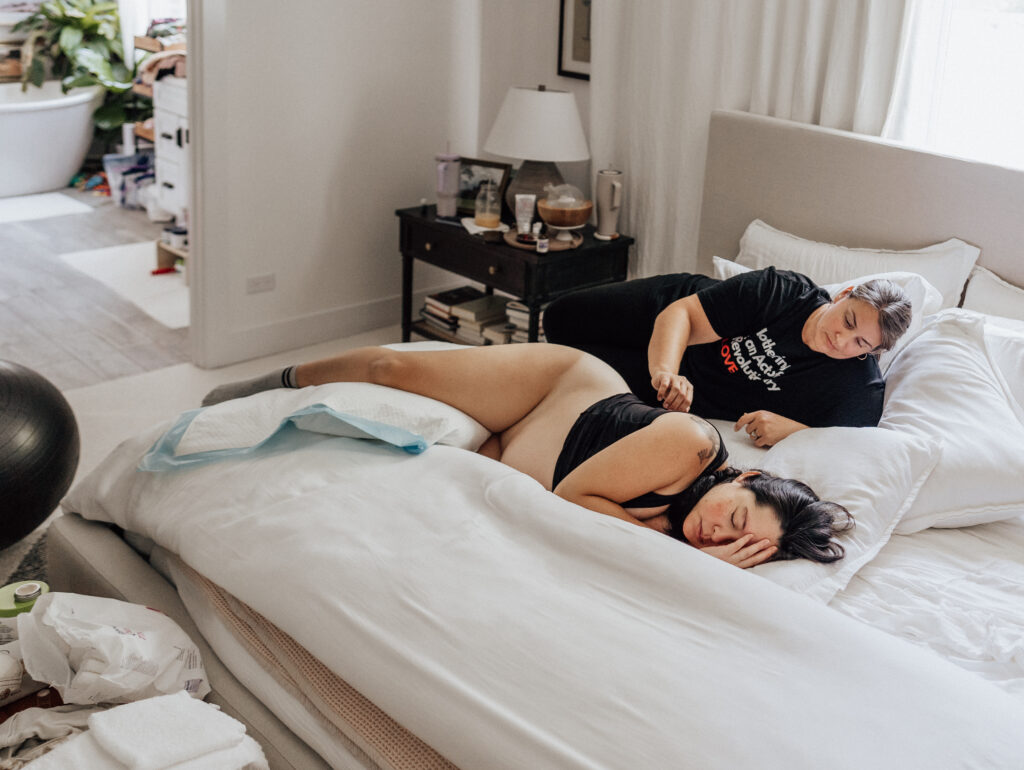 A cozy morning with a couple laughing in bed.